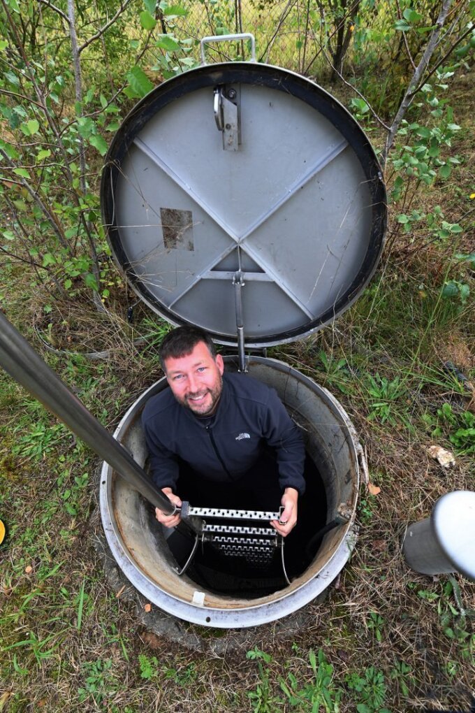 Dr Daniel Mirgorodsky climbs into a lysimeter through a hatch in the ground. The geologist uses this underground system to monitor the transfer of substances between the atmosphere, soil, and groundwater.